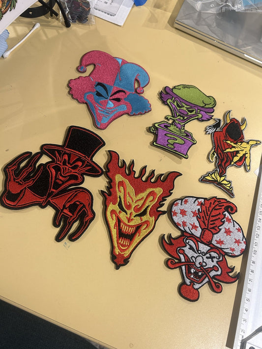 Joker's Cards patch set from an angle: jester, Riddle Box, Wraith, Ringmaster, Jeckel Brothers and Great Milenko